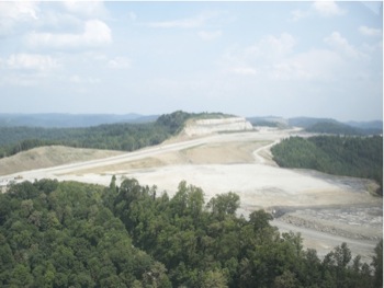 Photo of Highway Construction (Background) and New Residential and School Development Site (Foreground)
